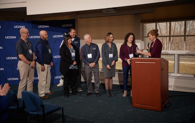 President Susan Herbst, right, presents the Team Award to Veterans Affairs and Military Programs during the UConn Spirit Awards ceremony held at Alumni Center